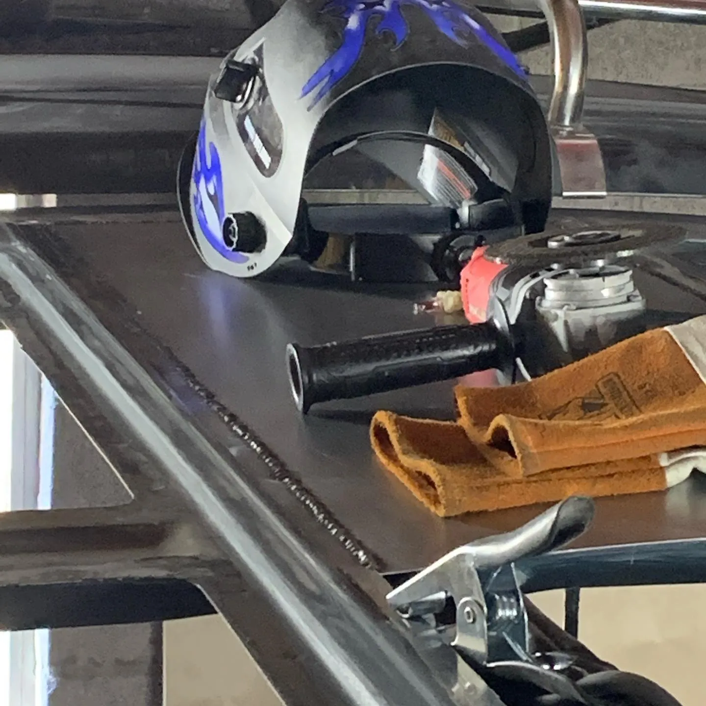 Stitch welding body panels into place